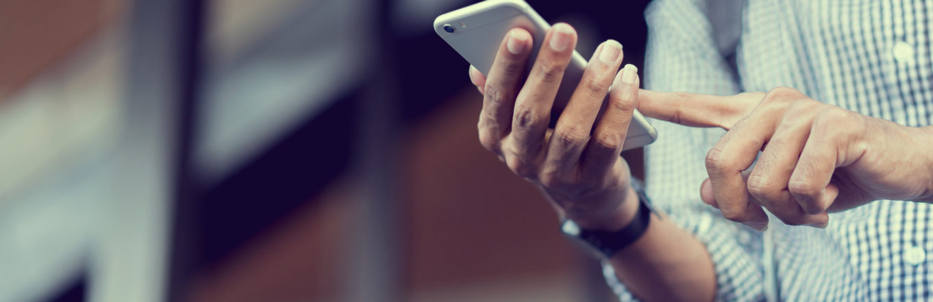 Man using social media on his phone